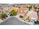 An aerial shot of a home with red tile roofing in a well-maintained residential neighborhood at 5526 Spruce Hill Ct, Las Vegas, NV 89148