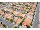 High-angle aerial shot of a planned residential area with terracotta roofs and neat landscaping at 5526 Spruce Hill Ct, Las Vegas, NV 89148