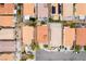 Overhead view of houses with terracotta roofs, patios, and driveways in a suburban setting at 5526 Spruce Hill Ct, Las Vegas, NV 89148
