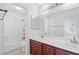 Bright bathroom with double vanity and tub/shower at 5526 Spruce Hill Ct, Las Vegas, NV 89148