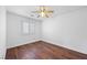 Bright bedroom with wood-look floors, ceiling fan and plantation shutters at 5526 Spruce Hill Ct, Las Vegas, NV 89148