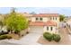 Beautiful exterior of this two-story home with a two-car garage and well-kept landscaping at 5526 Spruce Hill Ct, Las Vegas, NV 89148