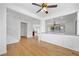 Open-concept living area with wood floors and bright lighting at 5526 Spruce Hill Ct, Las Vegas, NV 89148