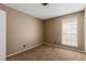Bedroom featuring carpet, neutral walls, and a bright window at 5905 Paseo Montana, Las Vegas, NV 89108