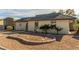 Well-maintained single-story home with manicured desert landscaping, secure gate and covered parking at 5905 Paseo Montana, Las Vegas, NV 89108