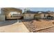 Charming single-story home featuring desert landscaping, secure gate and covered parking at 5905 Paseo Montana, Las Vegas, NV 89108