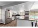 Open kitchen with a large center island, stainless appliances, and seamless flow to the backyard pool at 5905 Paseo Montana, Las Vegas, NV 89108