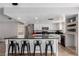 Bright kitchen features a large island with bar seating and stainless steel appliances at 5905 Paseo Montana, Las Vegas, NV 89108