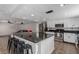 Bright, open kitchen with a center island, granite countertops, and stainless steel appliances at 5905 Paseo Montana, Las Vegas, NV 89108