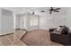 Cozy living room with carpet, large windows, and a comfortable sofa at 5905 Paseo Montana, Las Vegas, NV 89108