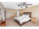 Comfortable main bedroom featuring a king bed, ceiling fan, and neutral tones at 5905 Paseo Montana, Las Vegas, NV 89108