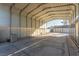 Large covered parking structure with a spacious concrete pad and block wall at 5905 Paseo Montana, Las Vegas, NV 89108