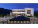 Stunning modern home showcasing a sleek pool, and outdoor lounge areas in a beautifully landscaped backyard at 611 Grand Rim Dr, Henderson, NV 89012