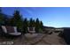 Outdoor patio with comfortable seating and serene city views at dusk at 611 Grand Rim Dr, Henderson, NV 89012