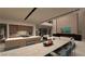 Modern kitchen featuring a large island, sleek countertops, and an adjacent living area with a fireplace at 611 Grand Rim Dr, Henderson, NV 89012