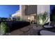 Outdoor patio with a water feature, lush greenery, and cozy seating perfect for relaxation at 611 Grand Rim Dr, Henderson, NV 89012