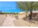 Scenic community park featuring walking path, shaded benches, playground equipment, and lovely landscaping at 6335 Pacific Sky St, North Las Vegas, NV 89081