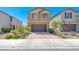 Charming two-story home with brick paver driveway, mature landscaping and a two-car garage at 6335 Pacific Sky St, North Las Vegas, NV 89081