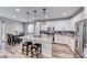 Well-lit kitchen with stainless steel appliances and views into the dining area at 6335 Pacific Sky St, North Las Vegas, NV 89081