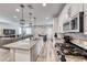 Granite counters highlight this kitchen, which also features stainless steel appliances at 6335 Pacific Sky St, North Las Vegas, NV 89081