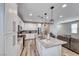 Well-lit kitchen with stainless steel appliances and views into the living room at 6335 Pacific Sky St, North Las Vegas, NV 89081