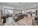 Open-concept living space seamlessly connects living, dining, and kitchen areas, perfect for entertaining at 6335 Pacific Sky St, North Las Vegas, NV 89081