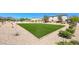 Well-maintained community turf area providing ample recreational space for various activities surrounded by desert landscaping at 6335 Pacific Sky St, North Las Vegas, NV 89081
