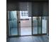 Balcony view with dark shades, tile flooring, and sliding glass doors at 646 Spotted Falcon St, Las Vegas, NV 89138