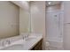 Bathroom features a double sink vanity, large mirror, and a shower-tub combo with white tiling at 646 Spotted Falcon St, Las Vegas, NV 89138