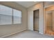 Bedroom with a window, closet, neutral paint and carpet and doorway to another room at 646 Spotted Falcon St, Las Vegas, NV 89138