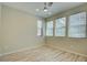 Bedroom featuring wood floors, ceiling fan, and bright windows at 646 Spotted Falcon St, Las Vegas, NV 89138