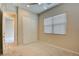 Cozy bedroom with closet space, plush carpet, and natural light at 646 Spotted Falcon St, Las Vegas, NV 89138