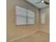 Simple bedroom with window with blinds, neutral paint and carpet at 646 Spotted Falcon St, Las Vegas, NV 89138
