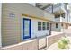 Stylish modern home with a vibrant blue front door and attractive landscaping at 646 Spotted Falcon St, Las Vegas, NV 89138