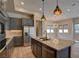 Modern kitchen features stainless steel appliances, granite countertops, and pendant lighting at 646 Spotted Falcon St, Las Vegas, NV 89138