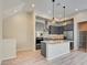 Modern kitchen features gray cabinets, granite countertops, and stainless steel appliances for a sleek culinary experience at 646 Spotted Falcon St, Las Vegas, NV 89138