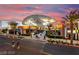 Outdoor shopping center featuring retail stores and palm trees at sunset at 646 Spotted Falcon St, Las Vegas, NV 89138
