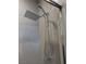 Modern shower featuring a rainfall shower head and hexagon patterned tile at 646 Spotted Falcon St, Las Vegas, NV 89138