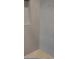 Close up view of the shower featuring gray hexagon tiles and a built-in bench at 646 Spotted Falcon St, Las Vegas, NV 89138