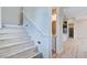 Stylish staircase leading to the upper level with hardwood flooring and modern lighting at 646 Spotted Falcon St, Las Vegas, NV 89138