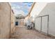 Narrow backyard with rock surface, enclosed by walls and featuring an access gate at 6513 Hyde Ave, Las Vegas, NV 89107