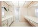 Bathroom featuring double sinks, vanity area and tile floors at 6513 Hyde Ave, Las Vegas, NV 89107