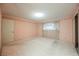 A bedroom with pink walls, white carpet, and ample closet space at 6513 Hyde Ave, Las Vegas, NV 89107