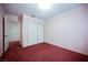 Bedroom with red carpet, closet and a doorway at 6513 Hyde Ave, Las Vegas, NV 89107