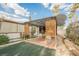 Covered gazebo with lattice sides, outdoor seating, and mature landscaping at 6513 Hyde Ave, Las Vegas, NV 89107