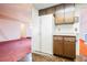 Kitchen featuring vintage appliances, wood cabinets, and breakfast bar in an open layout at 6513 Hyde Ave, Las Vegas, NV 89107