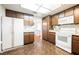 Open-concept kitchen with direct access to living area. Classic appliances, wooden cabinets at 6513 Hyde Ave, Las Vegas, NV 89107