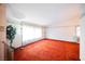 Spacious living room featuring bright light, textured carpet, and white walls with decorative trim at 6513 Hyde Ave, Las Vegas, NV 89107