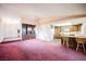 Expansive living room flowing into kitchen with breakfast bar, promoting open living at 6513 Hyde Ave, Las Vegas, NV 89107