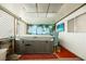 Enclosed sun room featuring a hot tub and tropical themed mural at 6513 Hyde Ave, Las Vegas, NV 89107